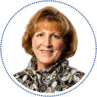 Janet M. Norton in a patterned blouse